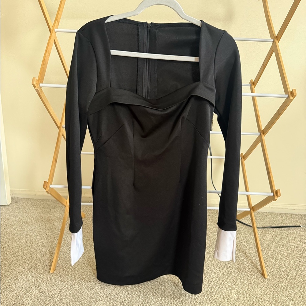 Elegant Black Dress with White Cuffs
